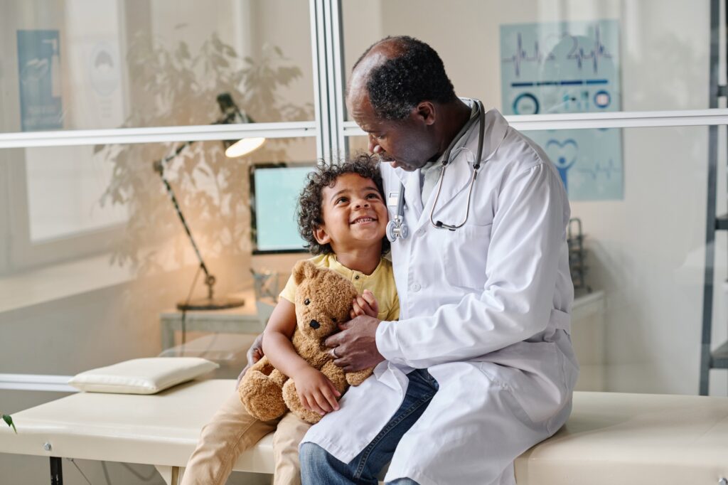 Doctor talking to kid at hospital